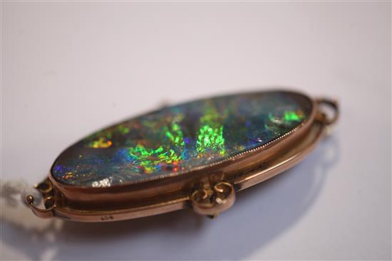 An Edwardian 9ct gold and black opal brooch, 51mm.